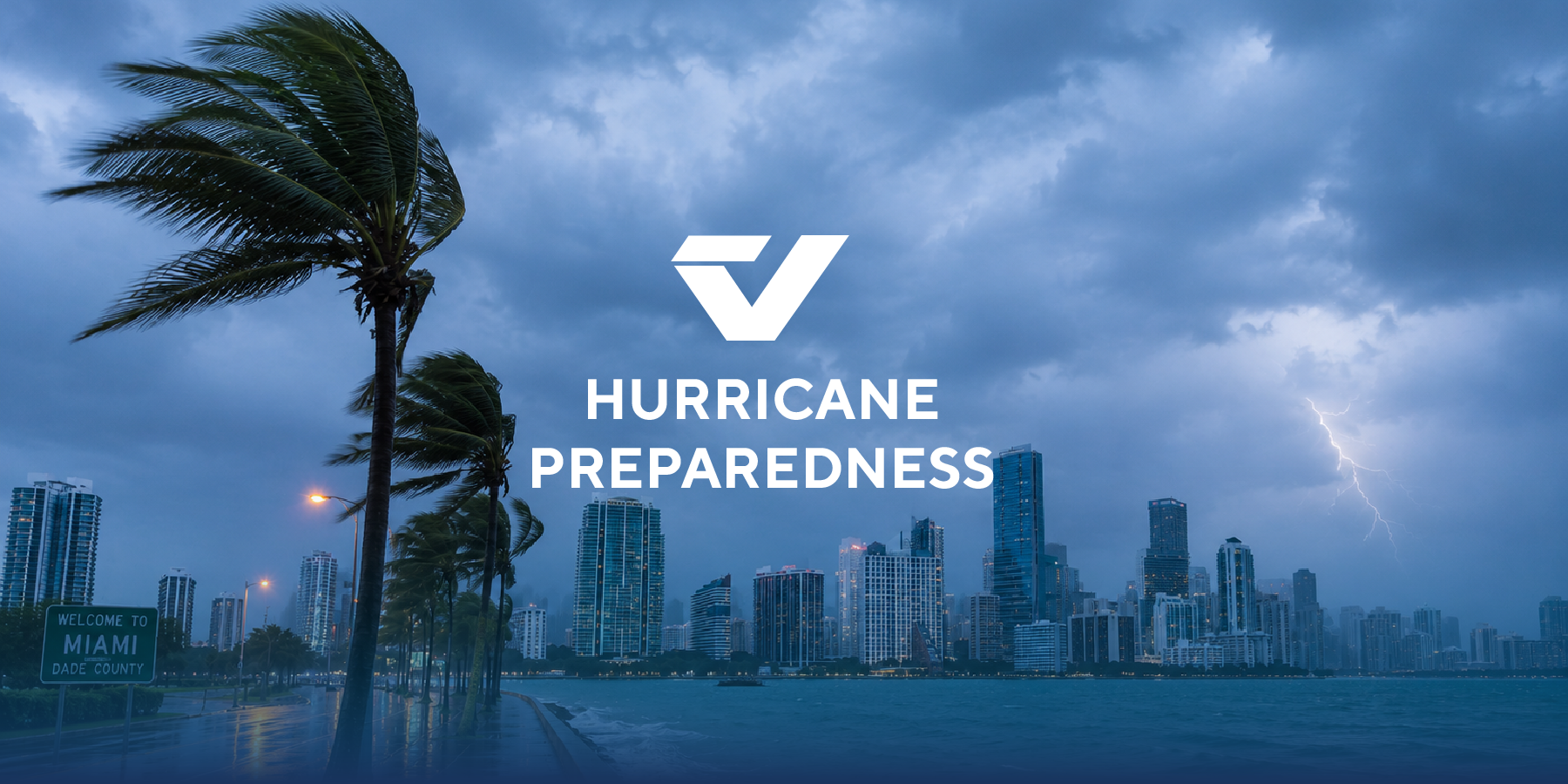 The city of Miami skyline of tall buildings is visible as a hurricane blows high winds and rain across the coastal area.